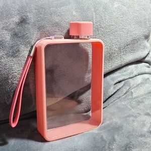 Water bottle flask with wrist strap.